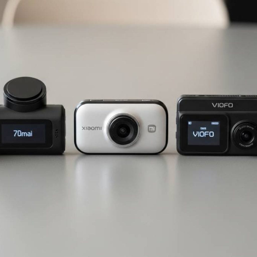 Side-by-side realistic photo of different dash cams (Qubo, 70mai, Xiaomi, Viofo, Yi), placed on a table, modern photography style, product showcase
